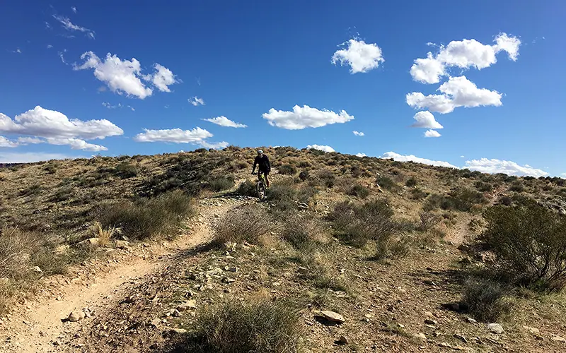man biking down mountain