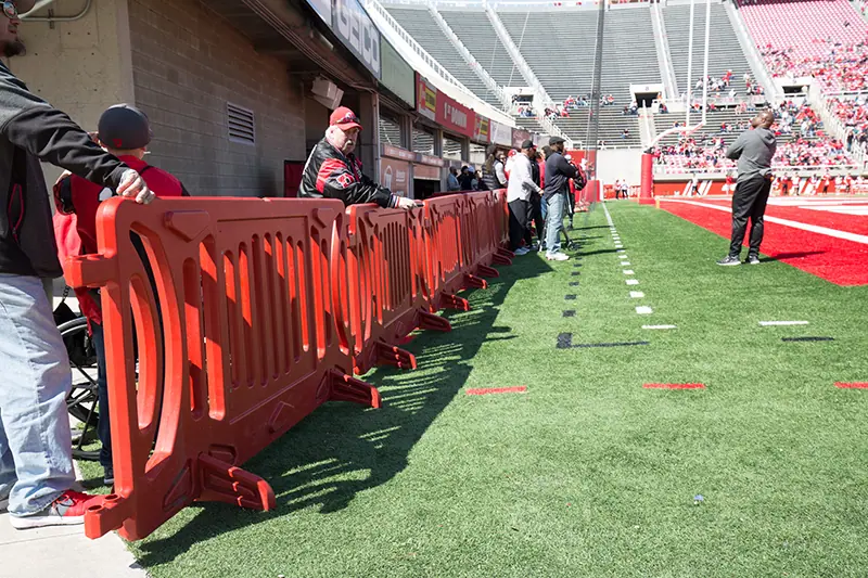 OTW red plastic pedestrian barricades on field at rice eccles stadium lets get ready to rumble jpg