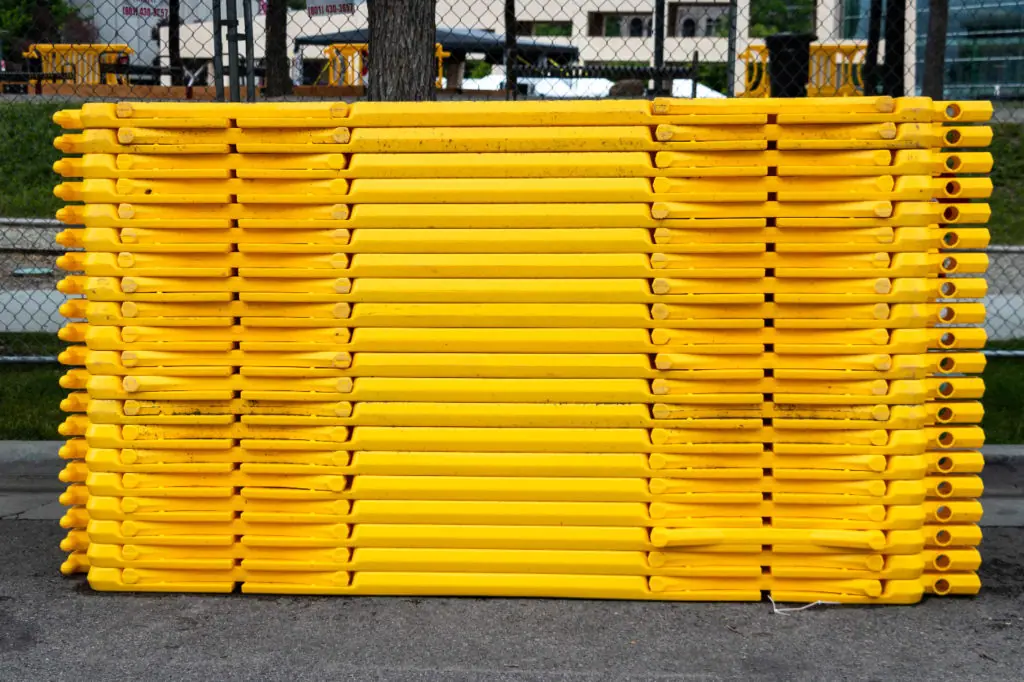 yellow crowd barricades stacked for event set up 1024x682 jpg