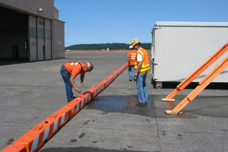 low profile barricade at airport water ballasted with workers OTW Safety jpg