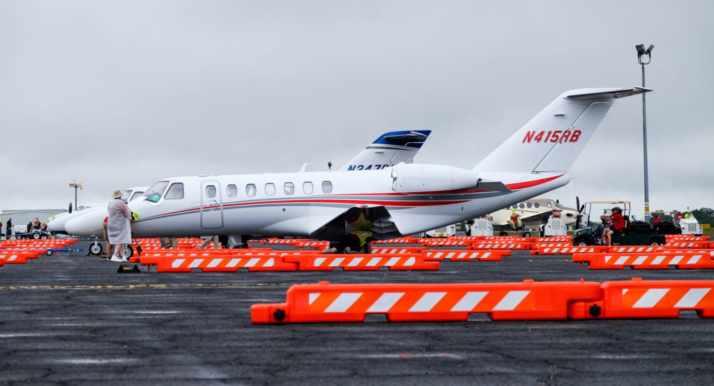 Textron Aviation jets positioned between lanes of Low-Profile Airport Barricades at the Special Olympics Airlift.