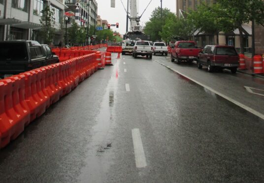 OTW Safety Traffic Barricades on Roadway Separating Pedestrian Walkways
