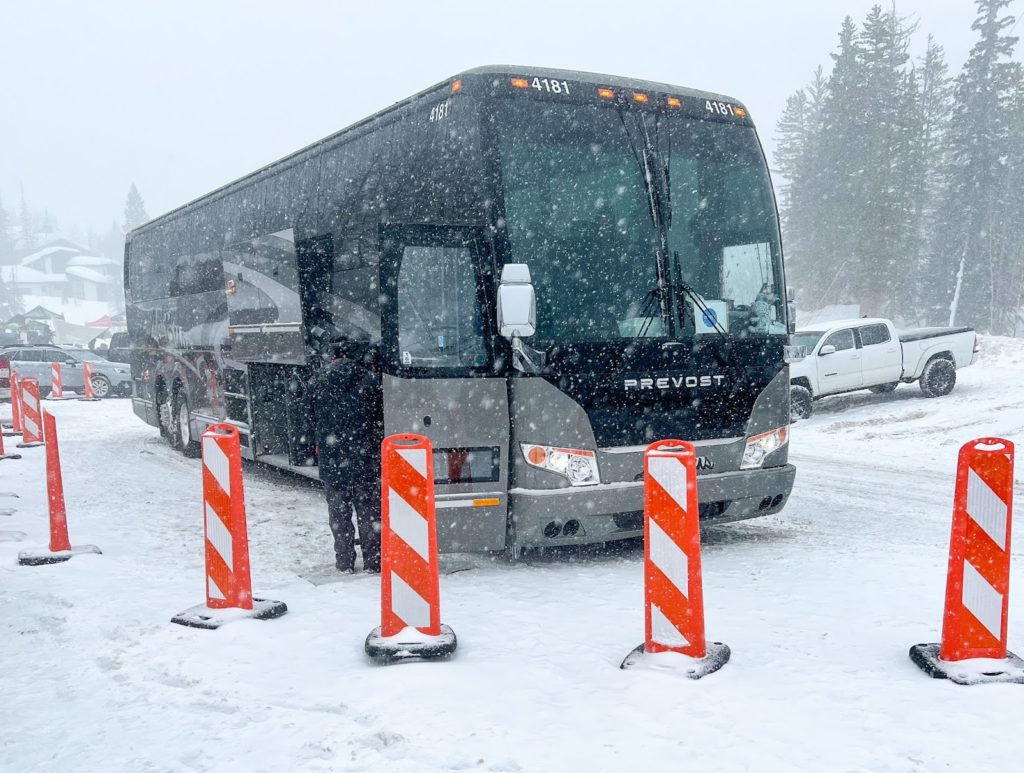 Vertical panels in the snow surrounding bus
