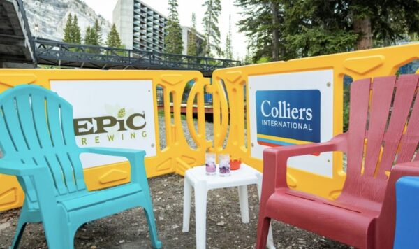 Yellow barricades with custom signage at outdoor event