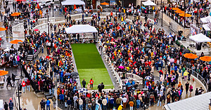 Introducing Temporary Fencing 6x10 chain link (4) aerial view of large crowd surrounding grass race track lined with white OTW Safety Billboard Barricades at Millcreek Common Doxie Derby