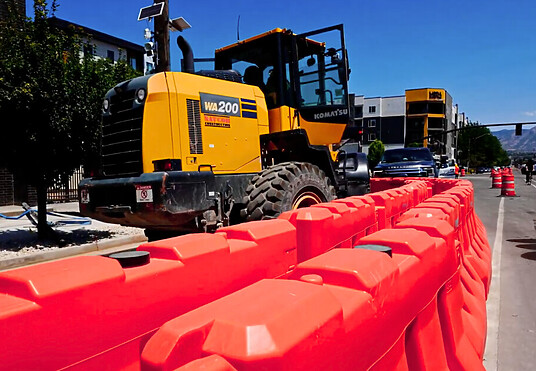 OTW Safety jersey barricades at construction site forming walking path for pedestrians