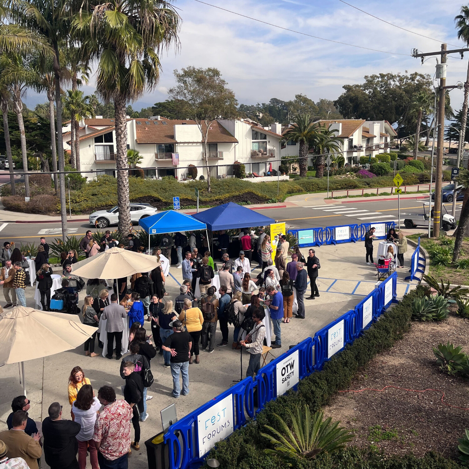 blue OTW Safety billboard barricades used for crowd control and to line the outdoor patio space at Fest Forums in Santa Monica