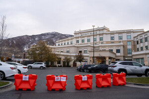 Five OTW Safety 32 inch LCD compact barricades in Hyatt hotel parking lot to keep cars out during striping.
