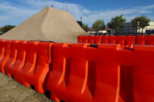 OTW Safety orange 42inch LCD jersey barricades surrounding bmx dirt course during X Games SLC 2025