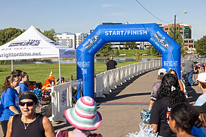 OTW Safety billboard barricades at Flutie 5K in SLC lining the race finish line