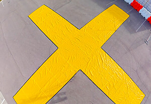 A large yellow high visibility x can be see from above when the OTW Vinyl Closure Marker is deployed