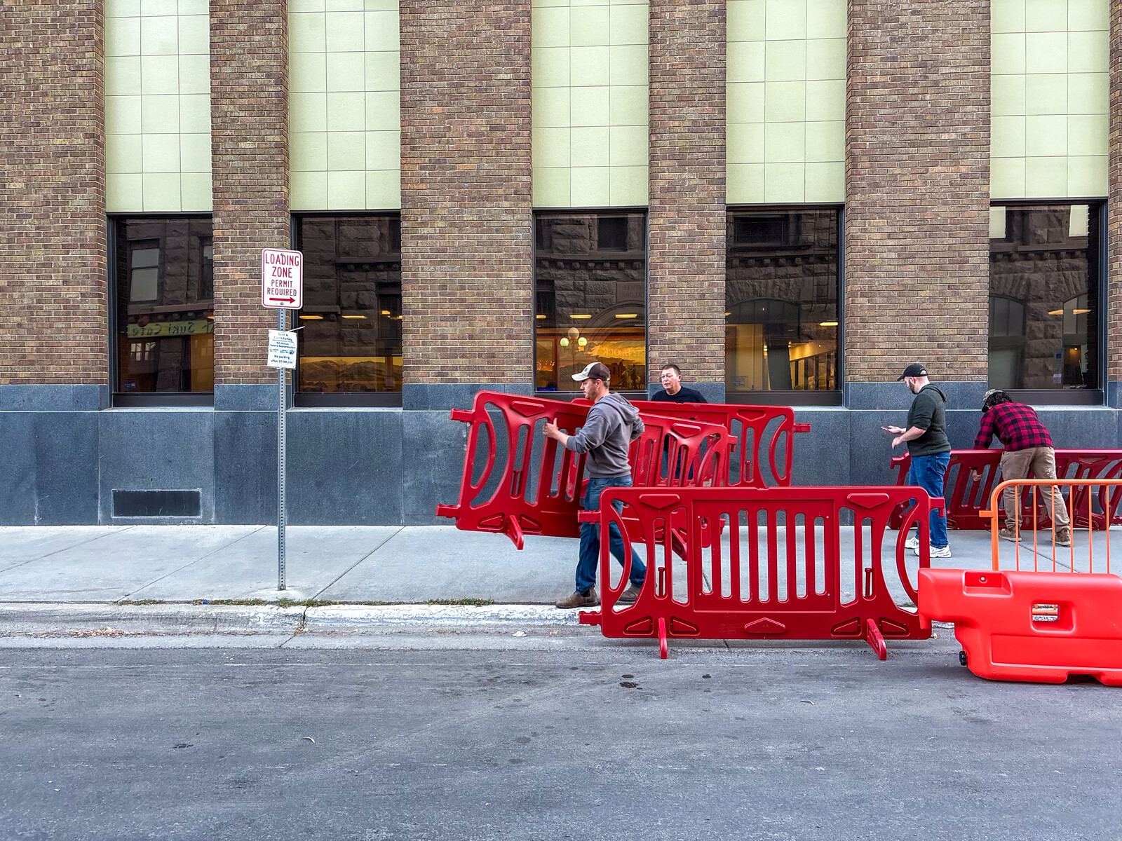 Using OTW Safety barricades for pedestrians at the store entrance during peak shopping times for crowd control safety measures.