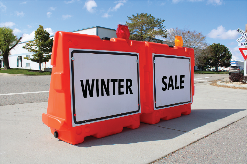 OTW 42X72 LCD Barricades with Bi-Directional Hazard Light Displaying signs that say "WINTER SALE"