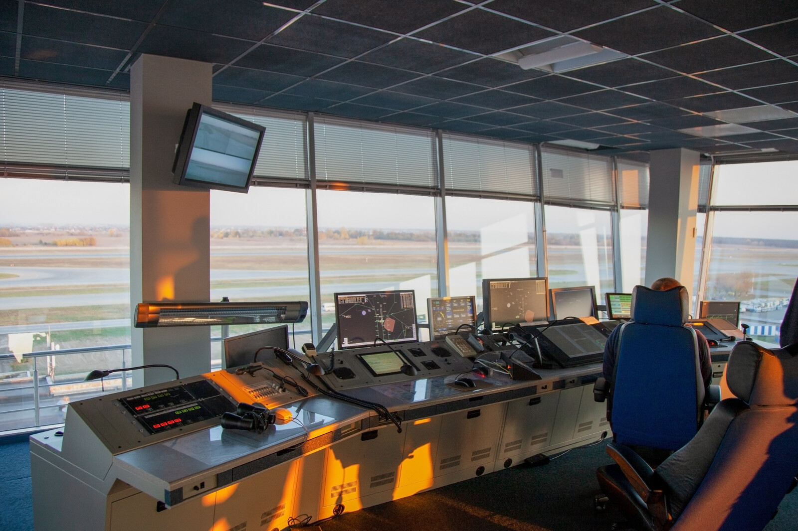 Dispatcher background. The workplace of the traffic manager at the airport at the tower. Chair, table, monitors, screens, and equipment. Air traffic controller work